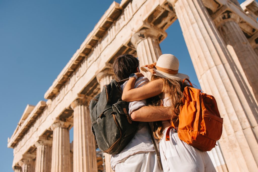 Tourist in front of the Parthenon temple - Blue Ribbon Travel