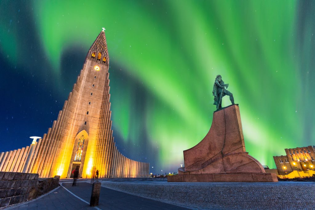 aurora borealis above hallgrimskirkja church in central of reykjavik city in Iceland - Blue Ribbon Travel