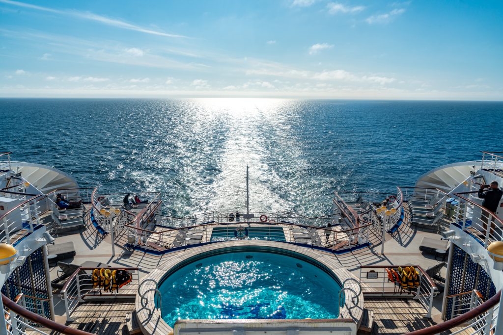 Back of large cruise ship looking over the blue Atlantic Ocean - Blue Ribbon Travel