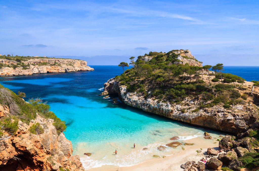 View of Cala des Moro beach and its azure blue water, Majorca island - Blue Ribbon Travel