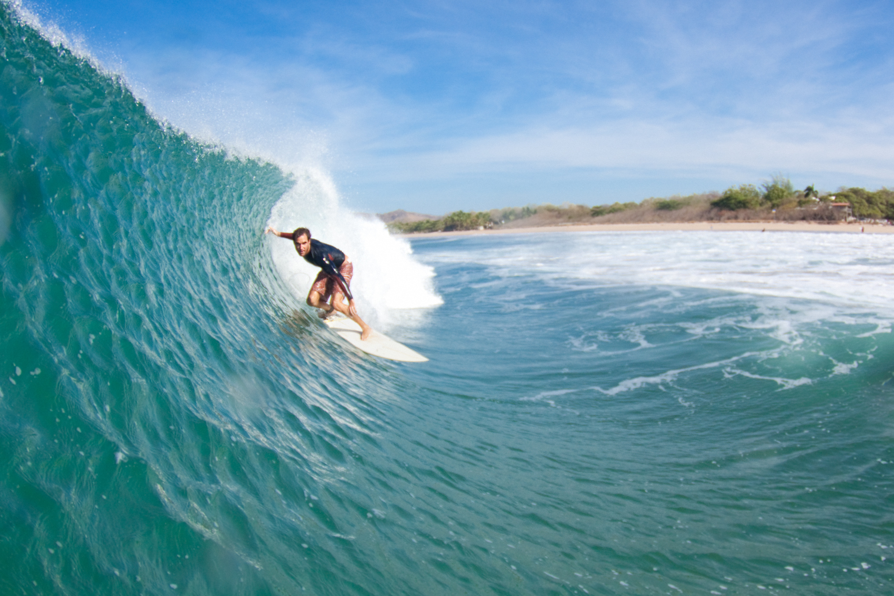 A person surfing on a wave in the ocean